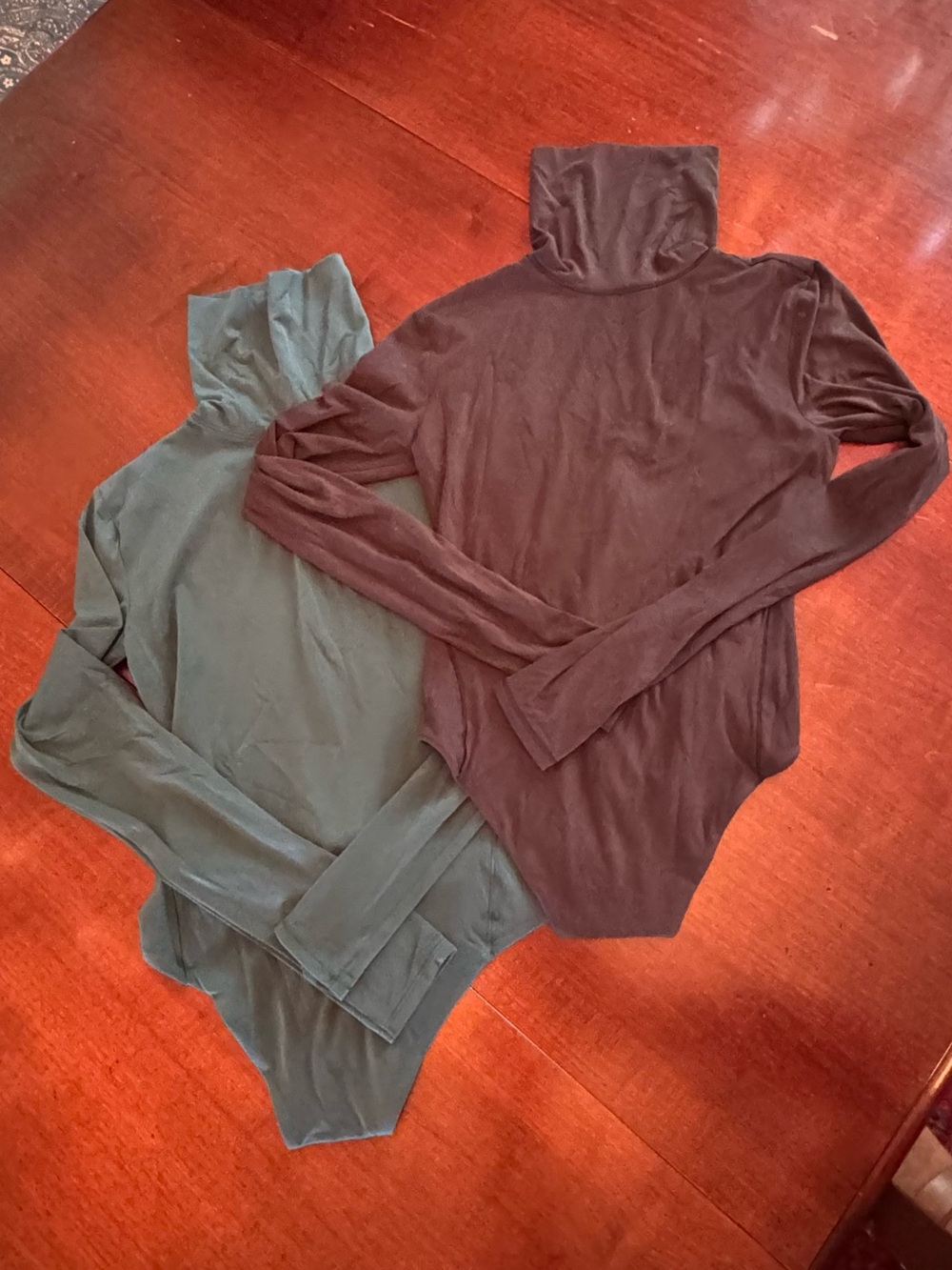 Lululemon long sleeve turtleneck bodysuits in green and brown